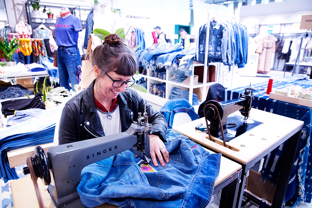 A portrait photo of a seamstress in John Lewis