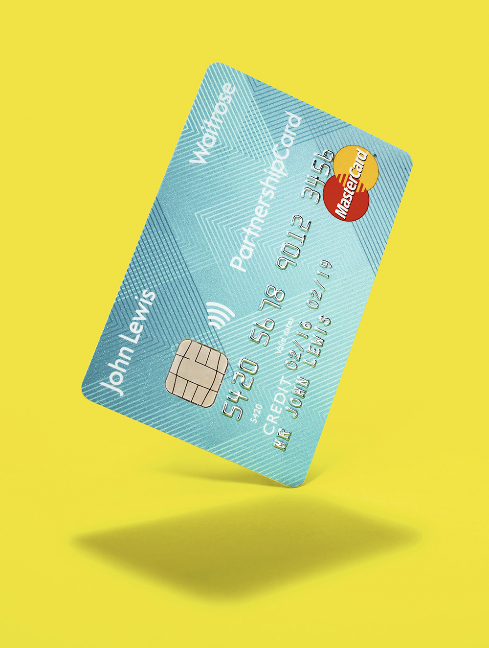 A studio photo of a JLP Partnership card
