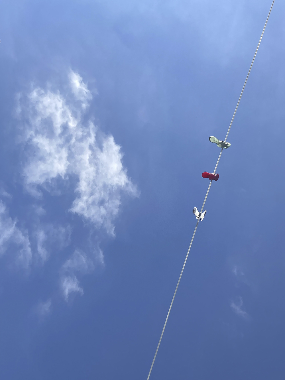 A photo of my washing line against a clear blue sky